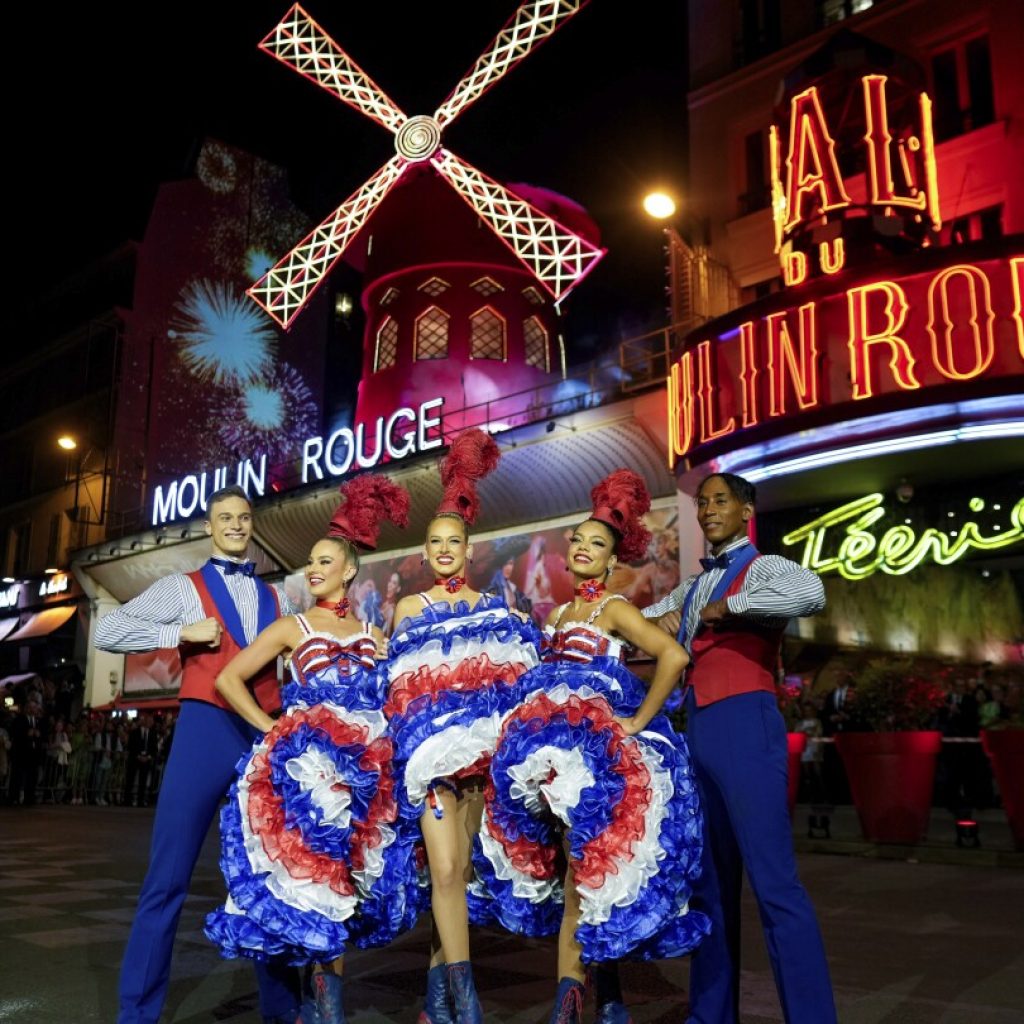 The Moulin Rouge cabaret in Paris has its windmill back, after a stunning collapse