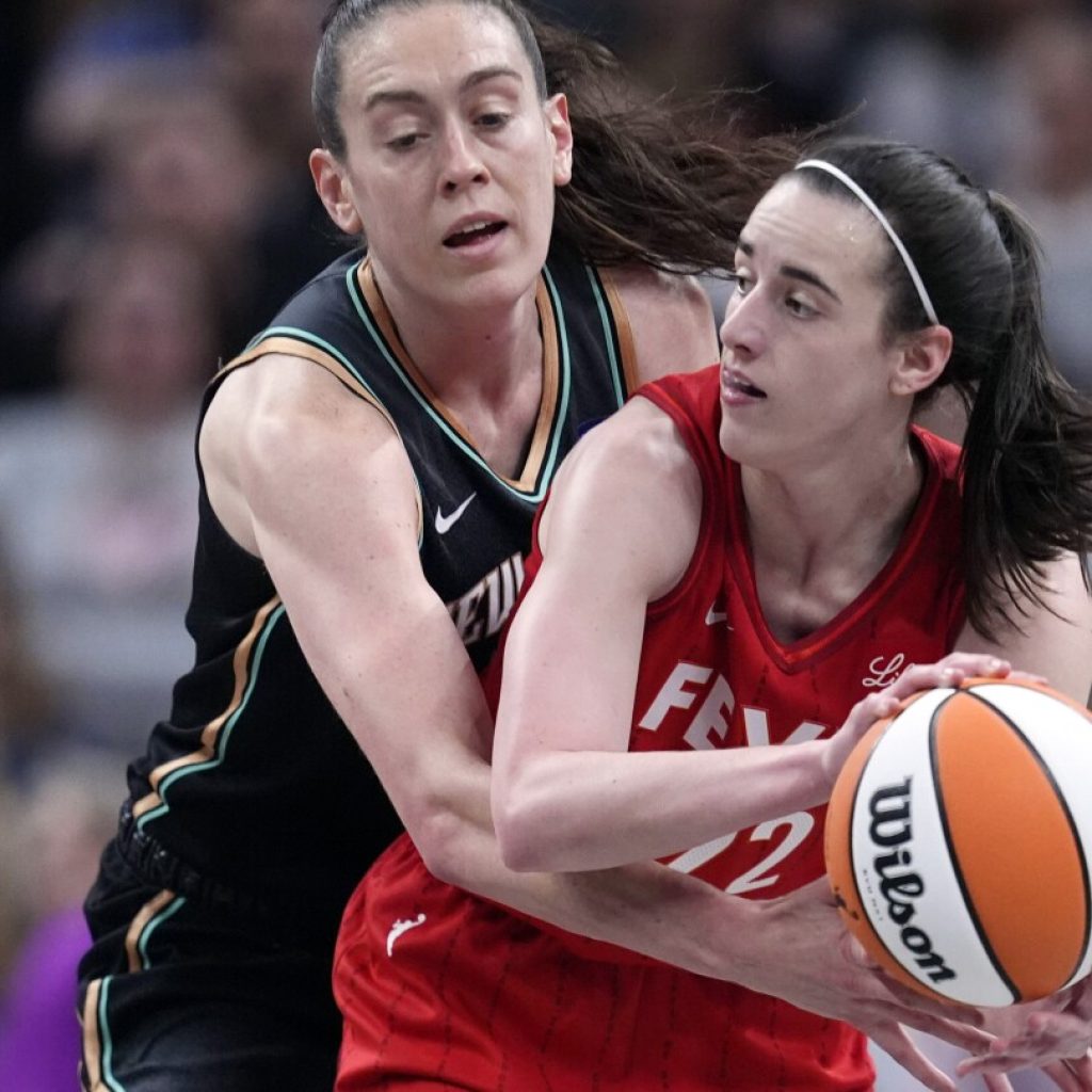 Caitlin Clark rallies Fever past Liberty 83-78 with first triple-double by WNBA rookie