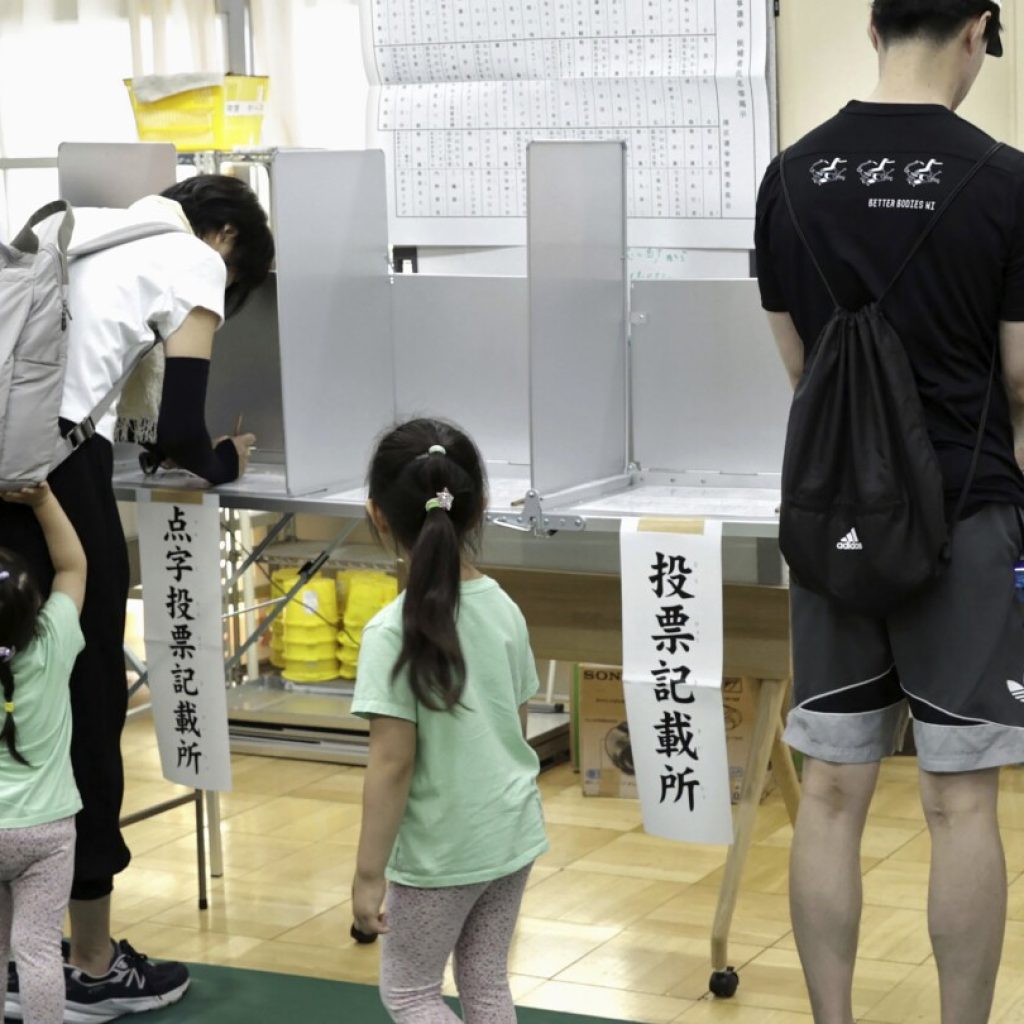 Voters in Tokyo cast ballots to decide whether to re-elect incumbent conservative as city’s governor