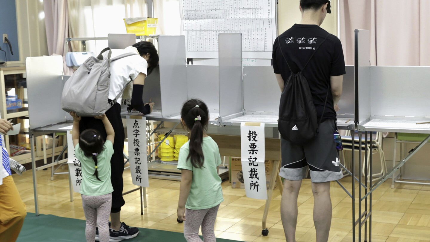 Voters in Tokyo cast ballots to decide whether to re-elect incumbent conservative as city’s governor