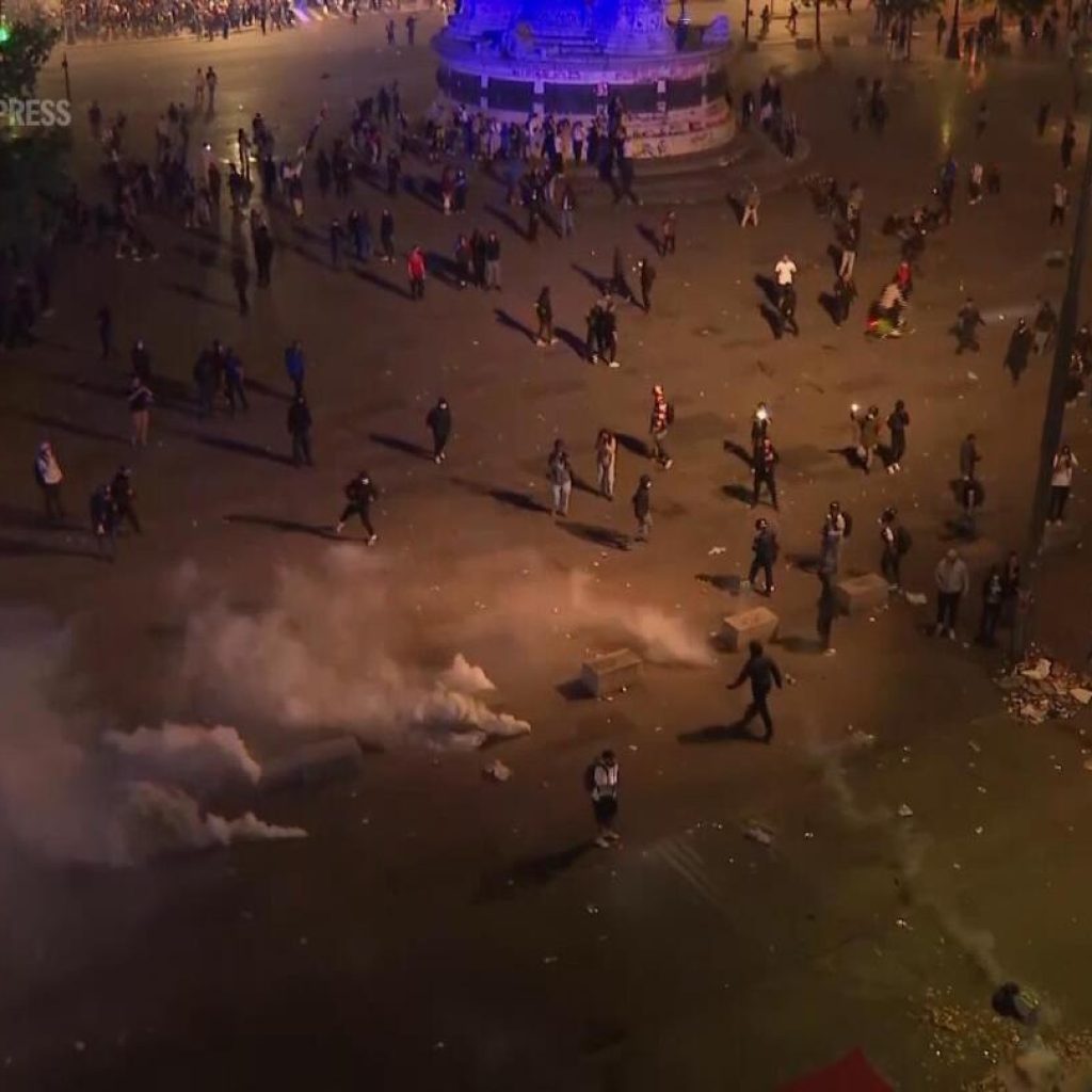 Crowds disperse after tear gas deployed at Place de la Republique | AP News