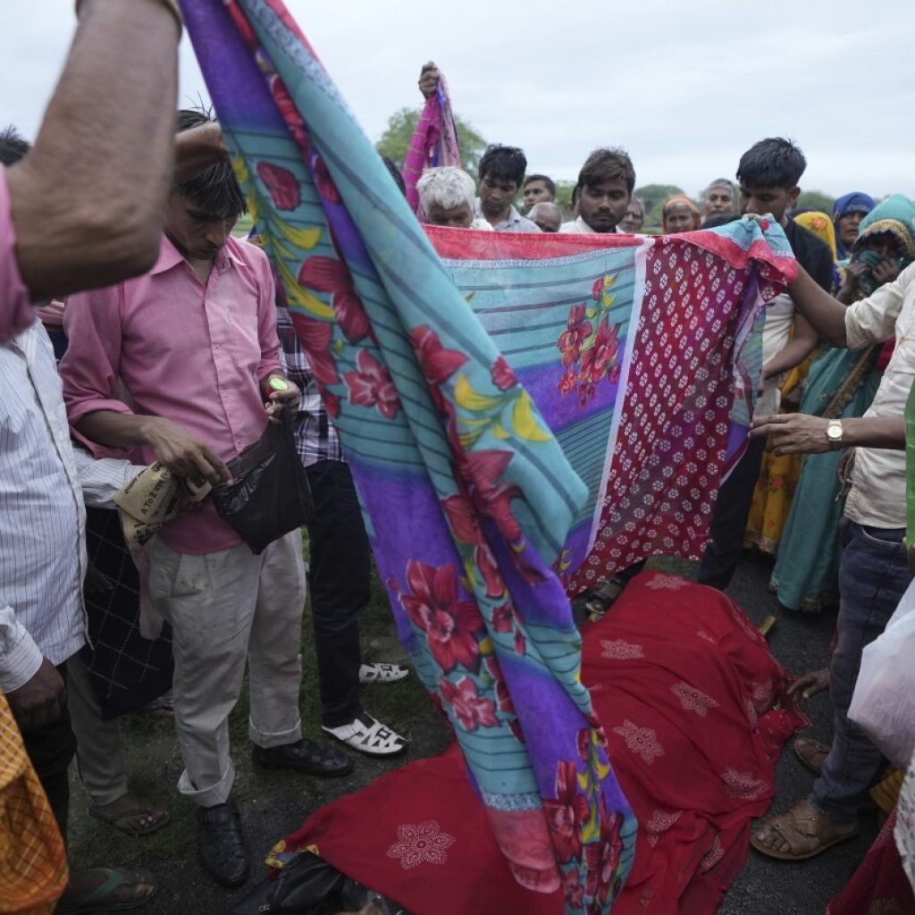 AP PHOTOS: Families of stampede victims in India ponder future without loved ones