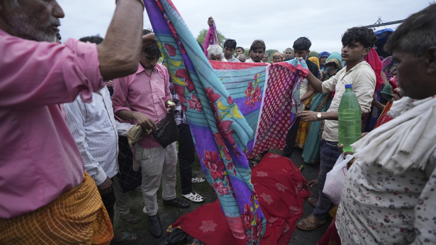 AP PHOTOS: Families of stampede victims in India ponder future without loved ones