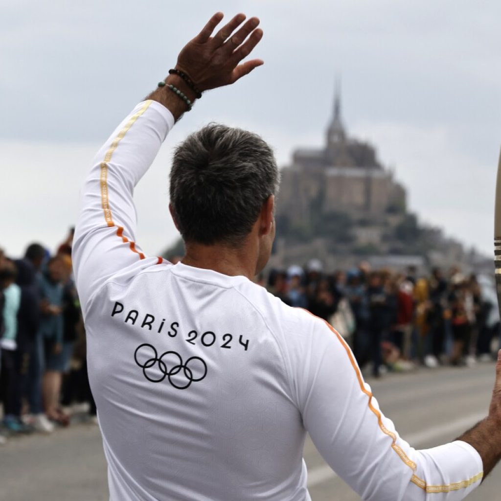 France’s Bastille Day parade meets the Olympic torch relay in an exceptional year