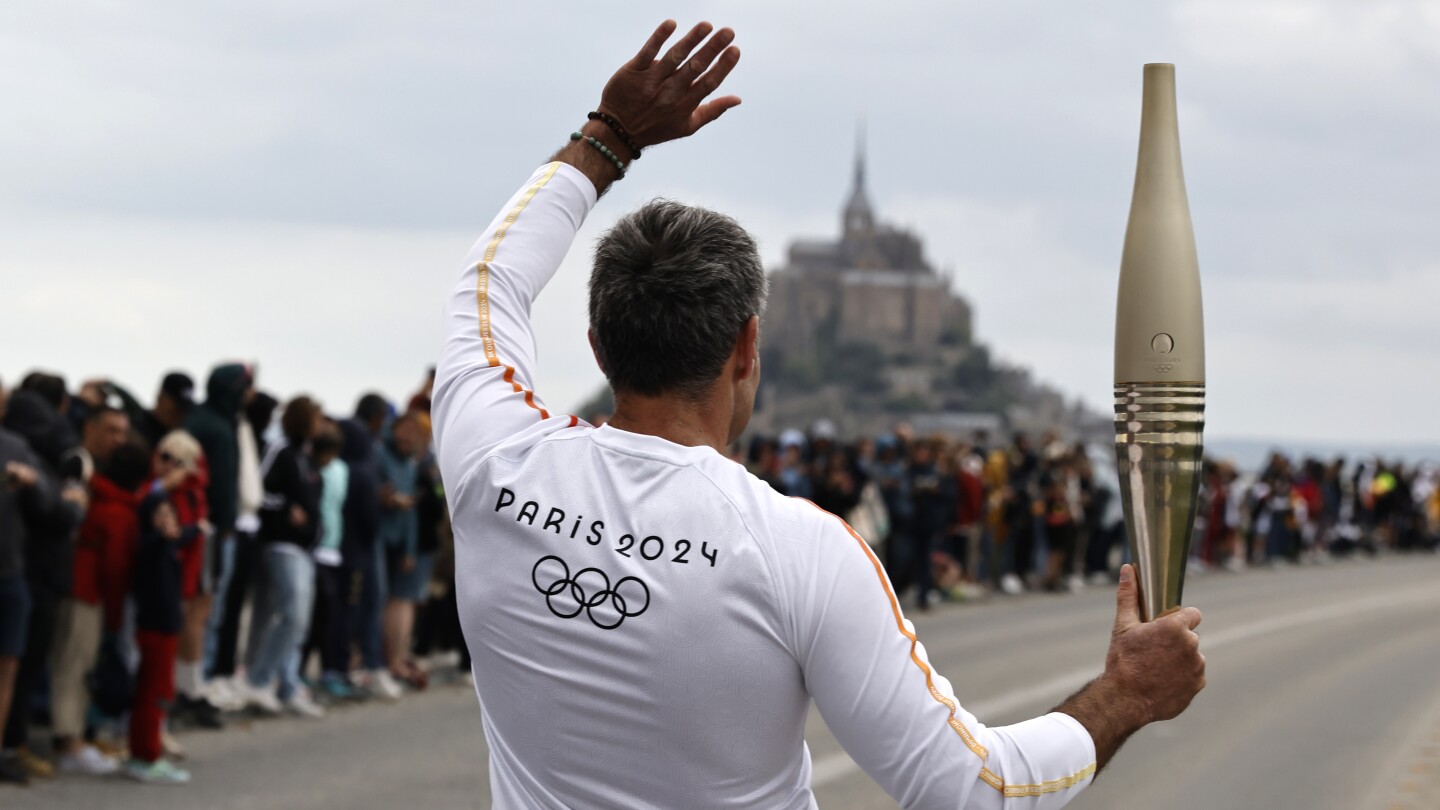 France’s Bastille Day parade meets the Olympic torch relay in an exceptional year