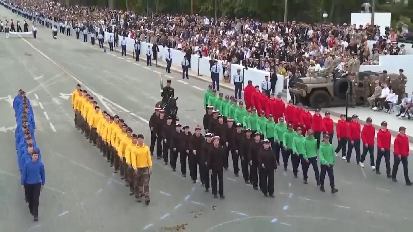 France’s Bastille Day parade meets the Olympic torch relay in an exceptional year | AP News