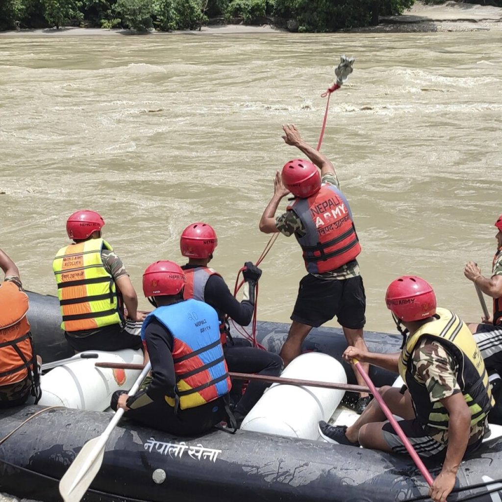 Rescuers in Nepal recover 7 bodies after a landslide swept 2 buses of people into a river