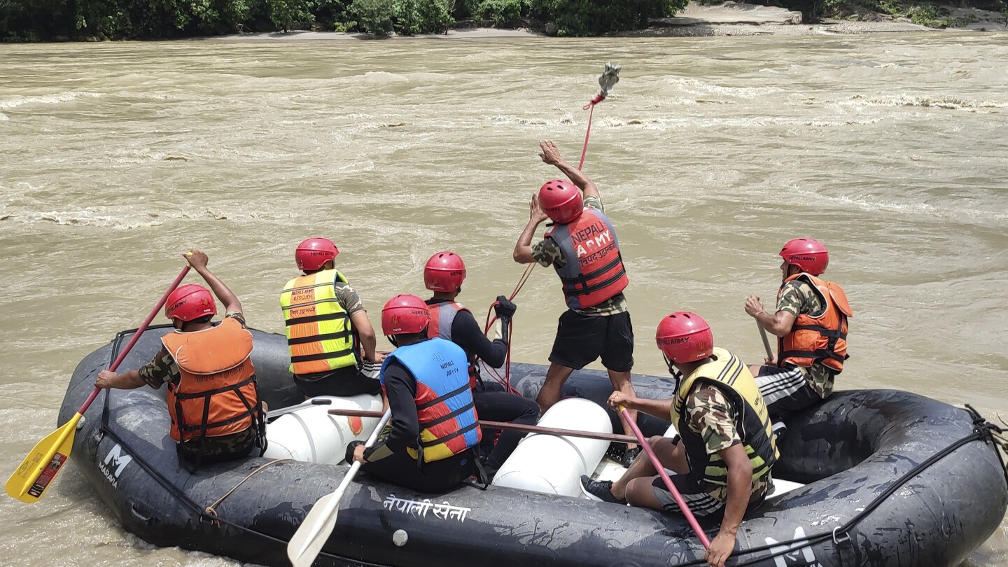 Rescuers in Nepal recover 7 bodies after a landslide swept 2 buses of people into a river