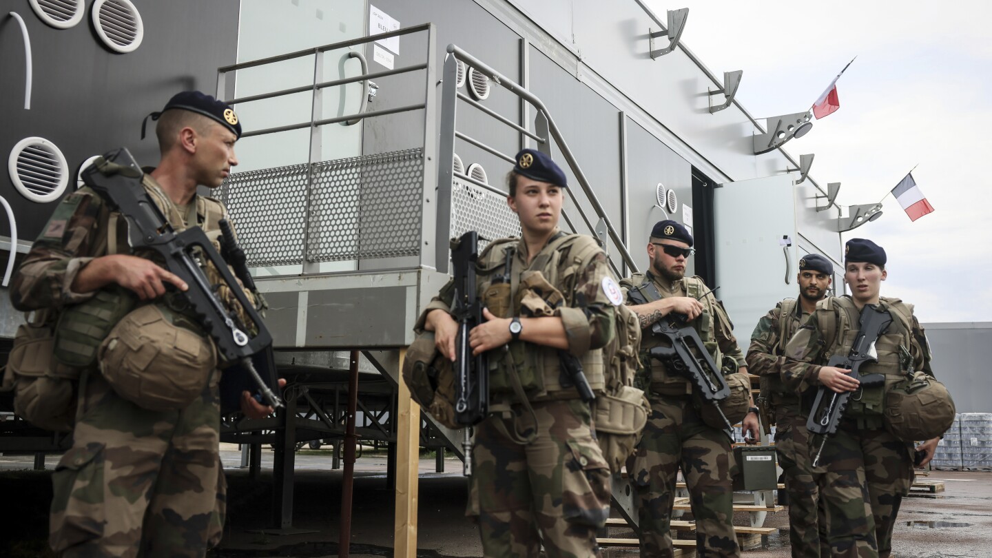 Man who stabbed a French soldier patrolling Paris ahead of Olympics is taken to psychiatric hospital