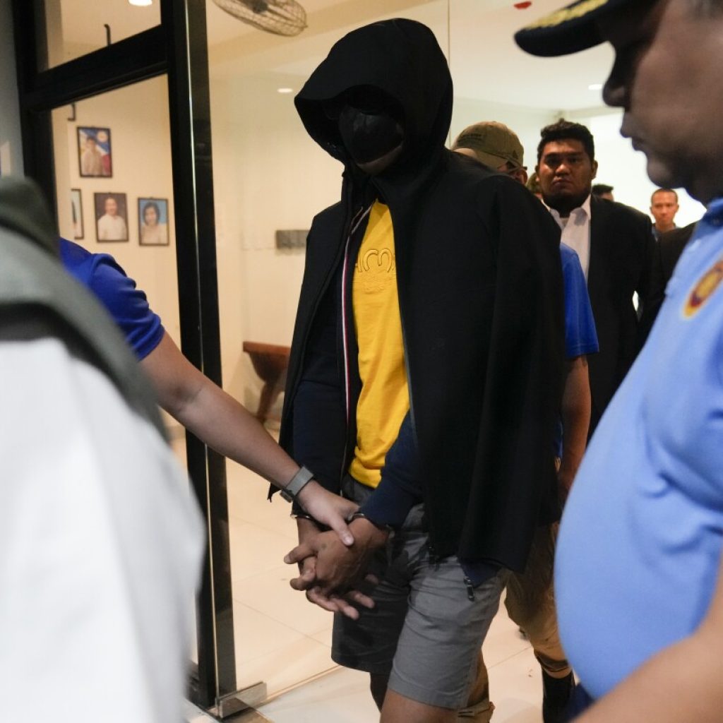 Philippine officials say suspect in the killings of 2 Australians and a Filipina has surrendered