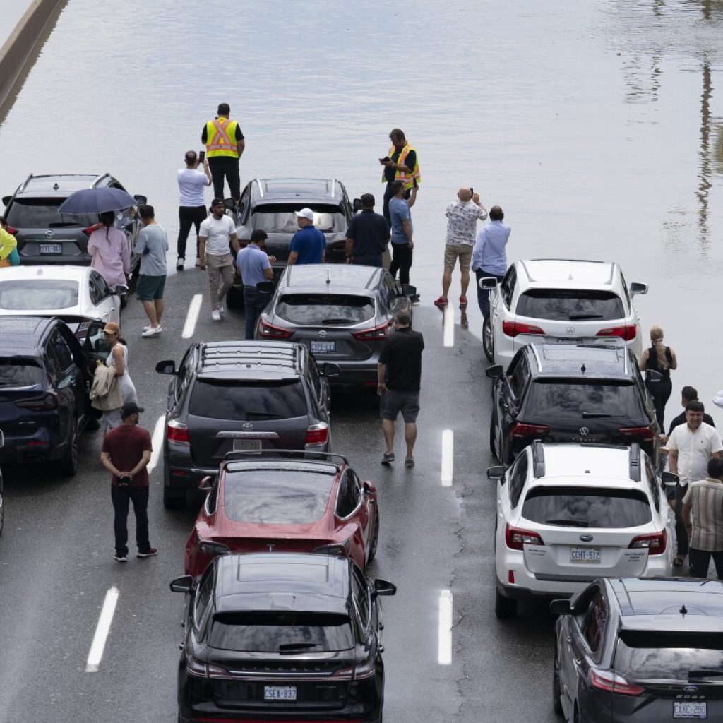 A major highway and roads are flooded as torrential rains hit Canada’s largest city