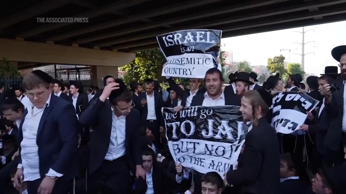 Tense scenes as police in Israel detain ultra-Orthodox Jewish men protesting military recruitment | AP News