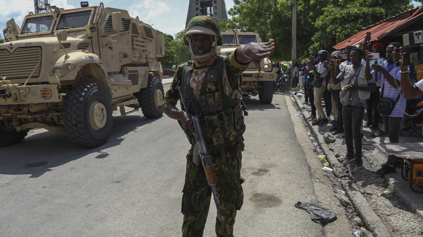 Haiti’s prime minister orders gangs to drop weapons and promises to take back control of the capital