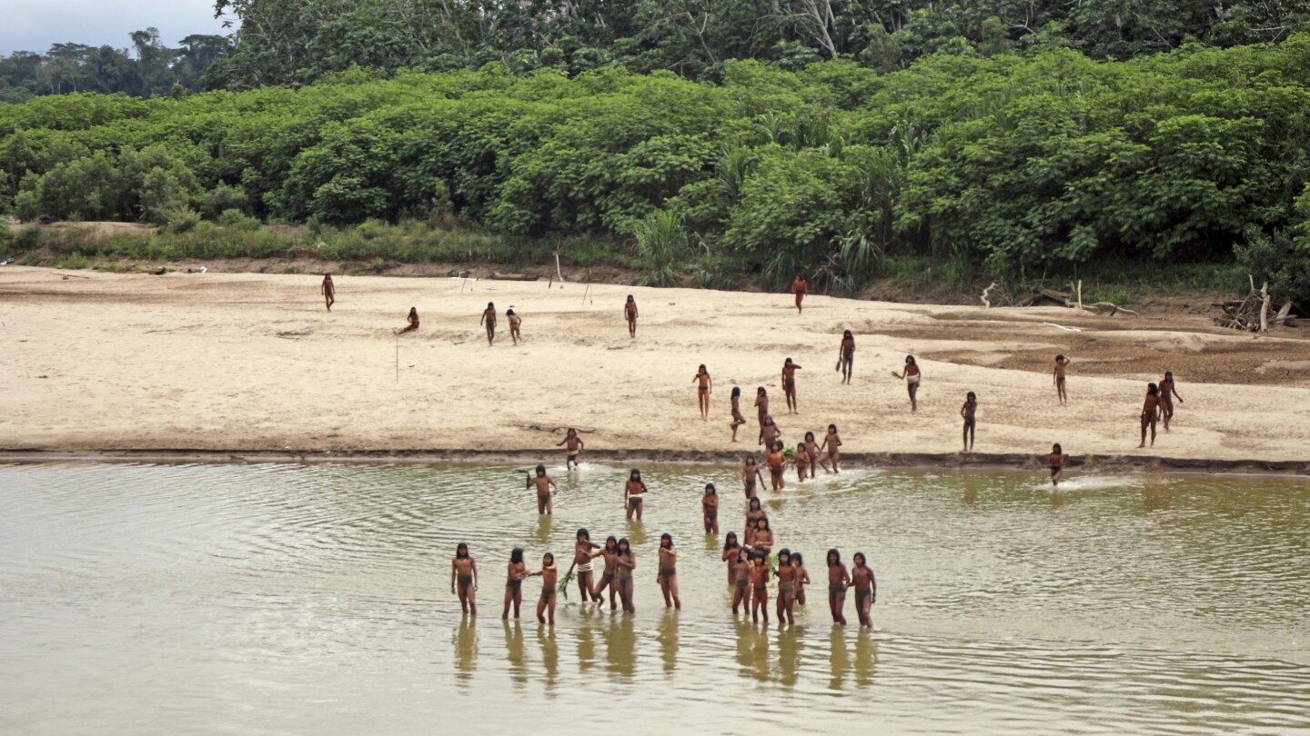 Group says photos of reclusive tribe on Peru beach show logging concessions are ‘dangerously close’