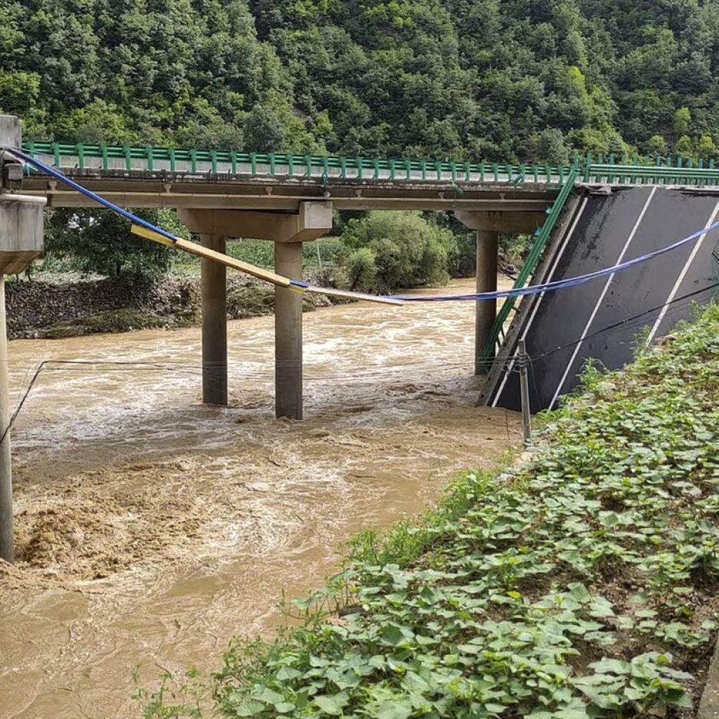 11 dead and dozens missing after a highway bridge in China crumbles in flooding and heavy storms