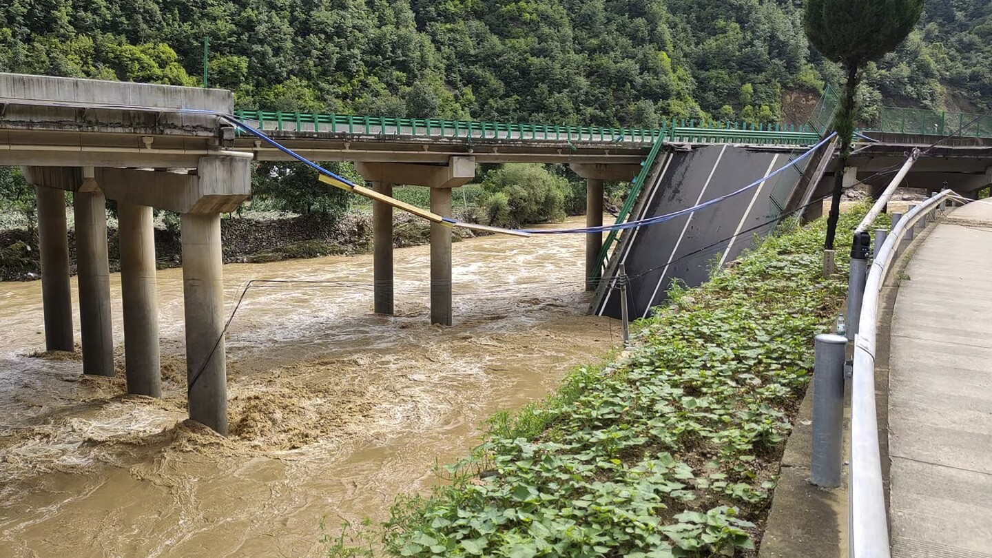 11 dead and dozens missing after a highway bridge in China crumbles in flooding and heavy storms