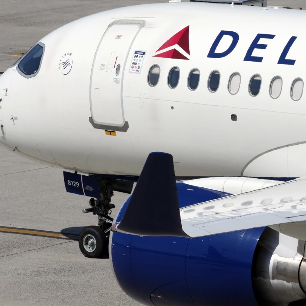 Delta Air Lines says cancellations continue as it tries to restore operations after tech outage