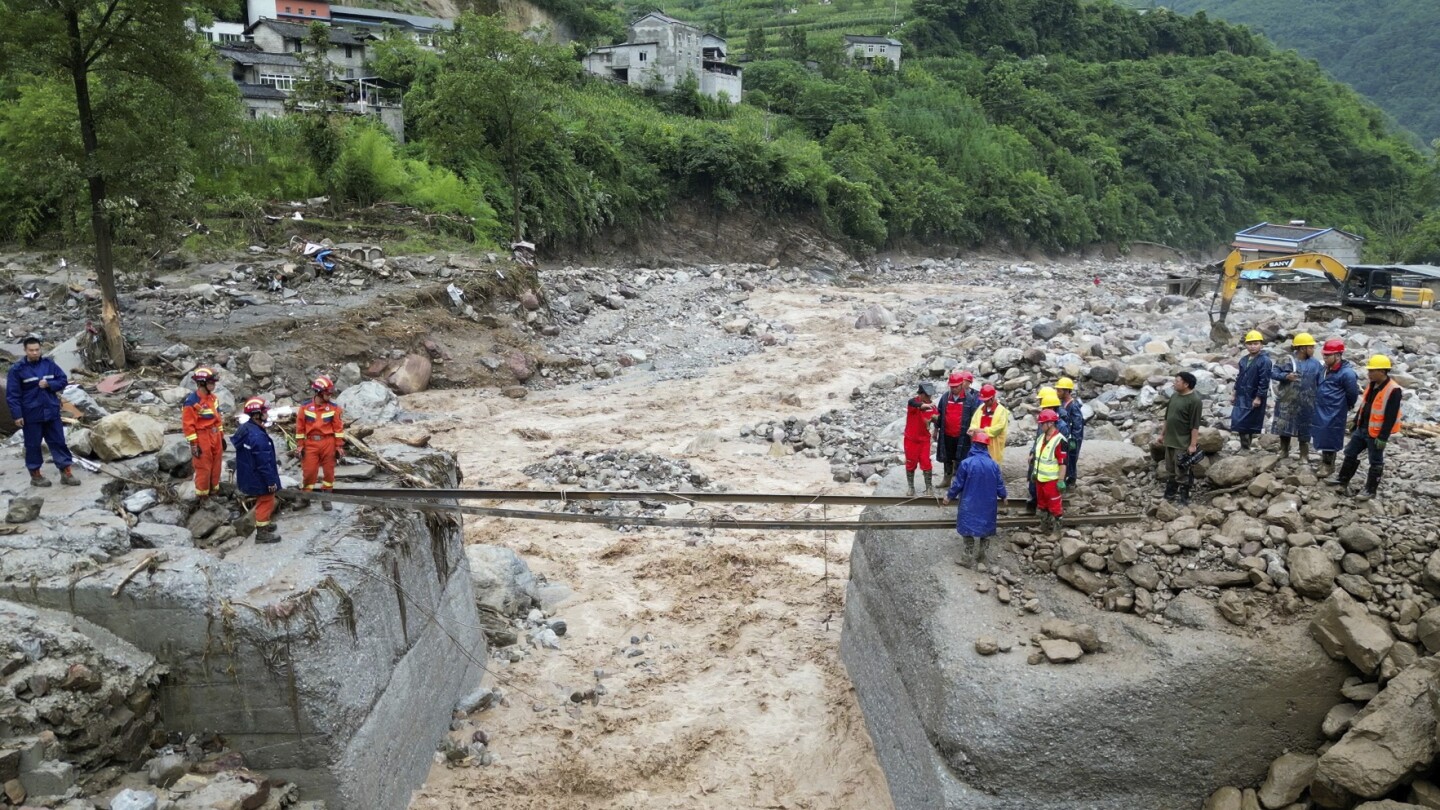 Rescuers search for dozens missing after flooding and a bridge collapse in China kill at least 25