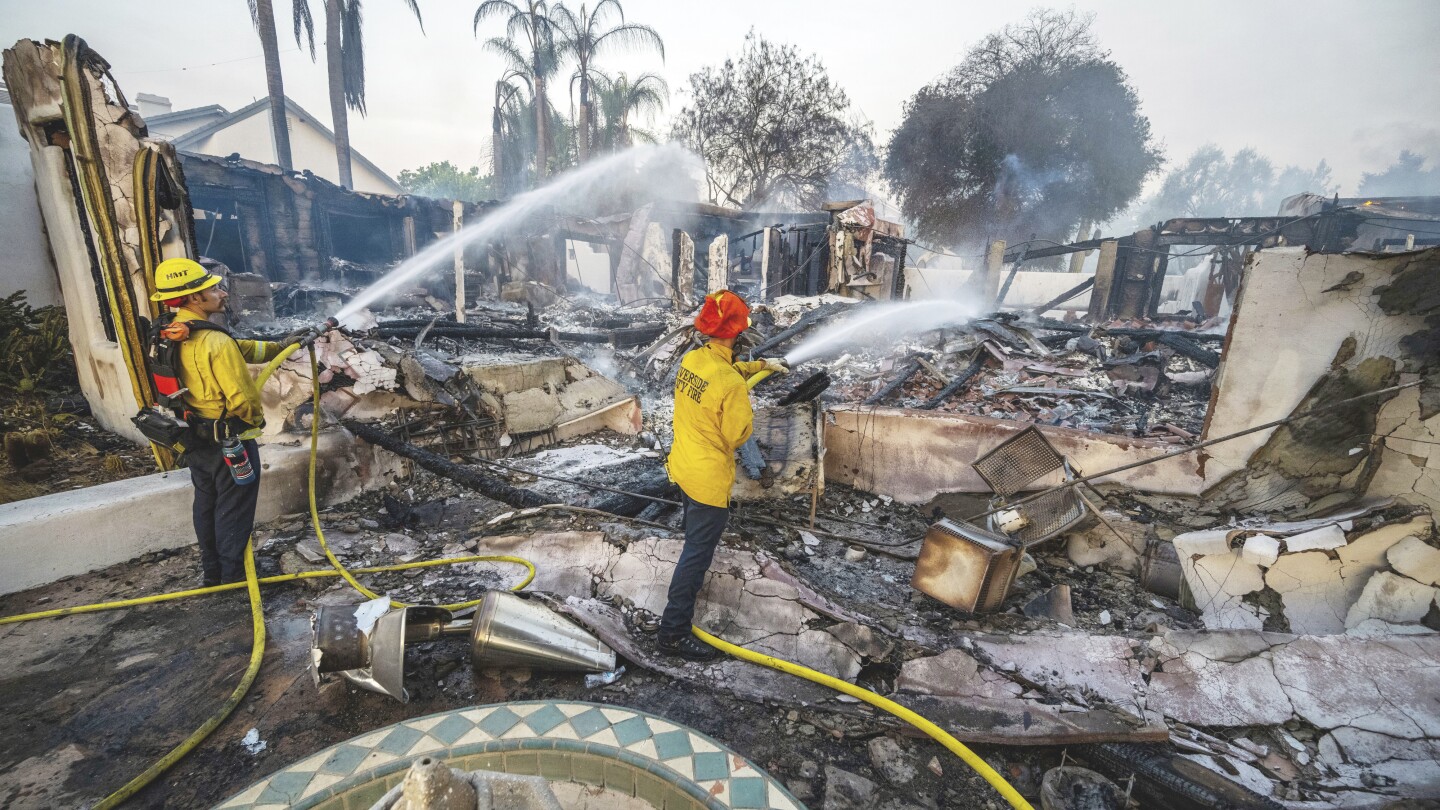 Wildfires plague the West amid a scorching heat wave. Homes burn in Southern California