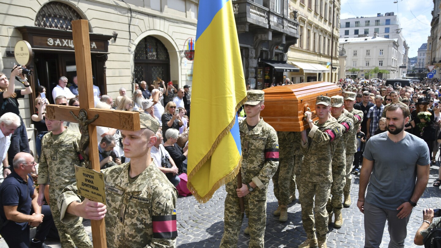 Thousands in Ukraine attend funeral of former lawmaker and critic of Russia who was killed in Lviv