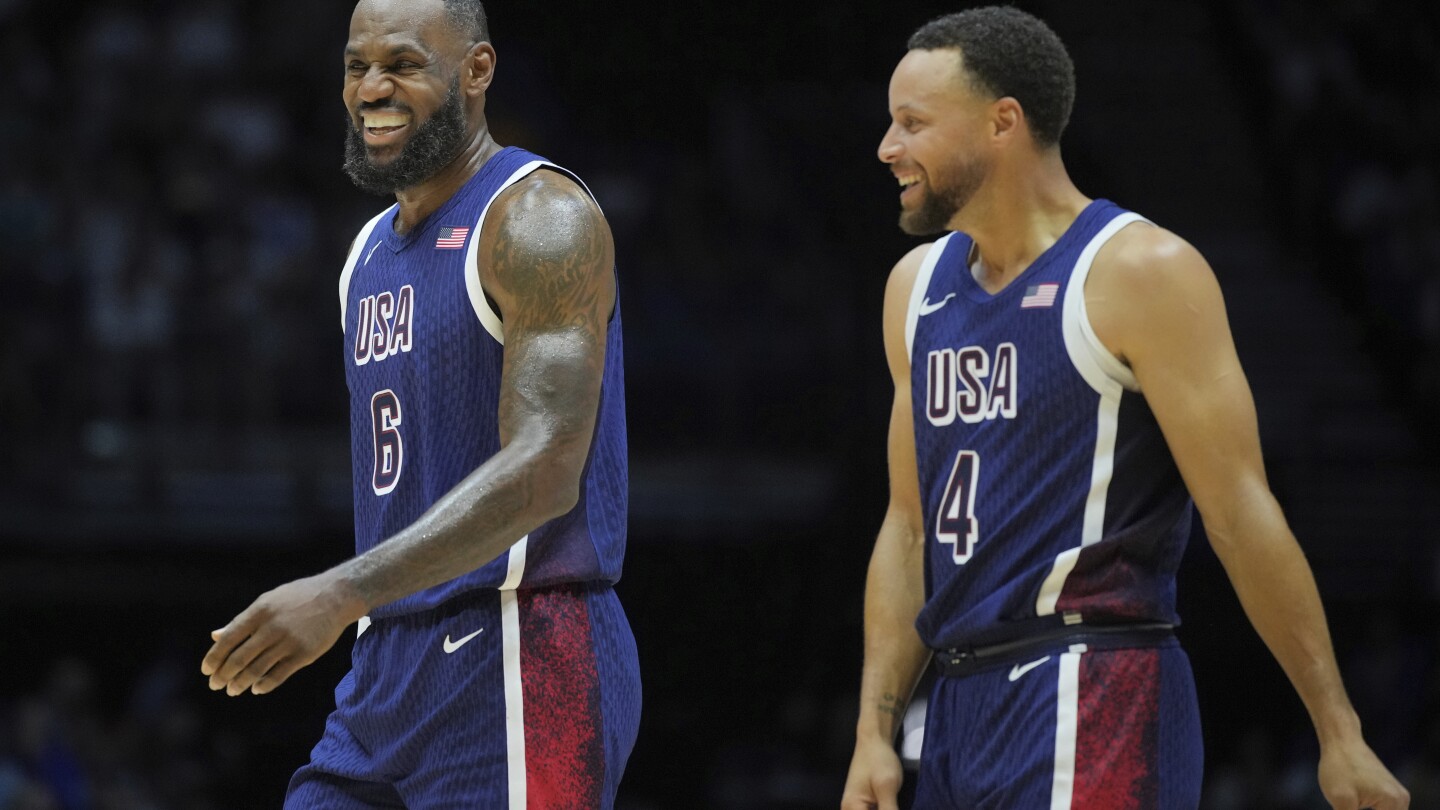 The US men’s basketball team arrives in France, with its Paris Olympics opener on Sunday