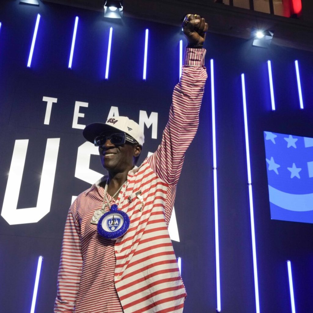 Flavor Flav is soaking up his 1st Olympic experience cheering on the US water polo teams