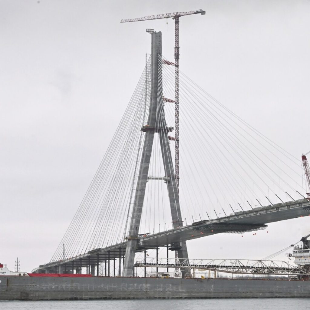 Workers link US, Canadian sides of new Gordie Howe International Bridge over Detroit River