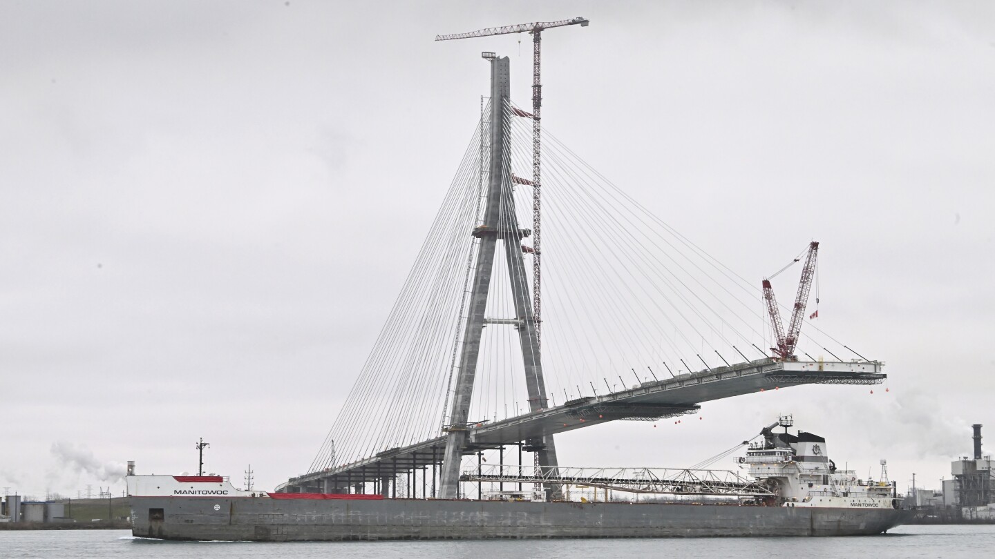 Workers link US, Canadian sides of new Gordie Howe International Bridge over Detroit River