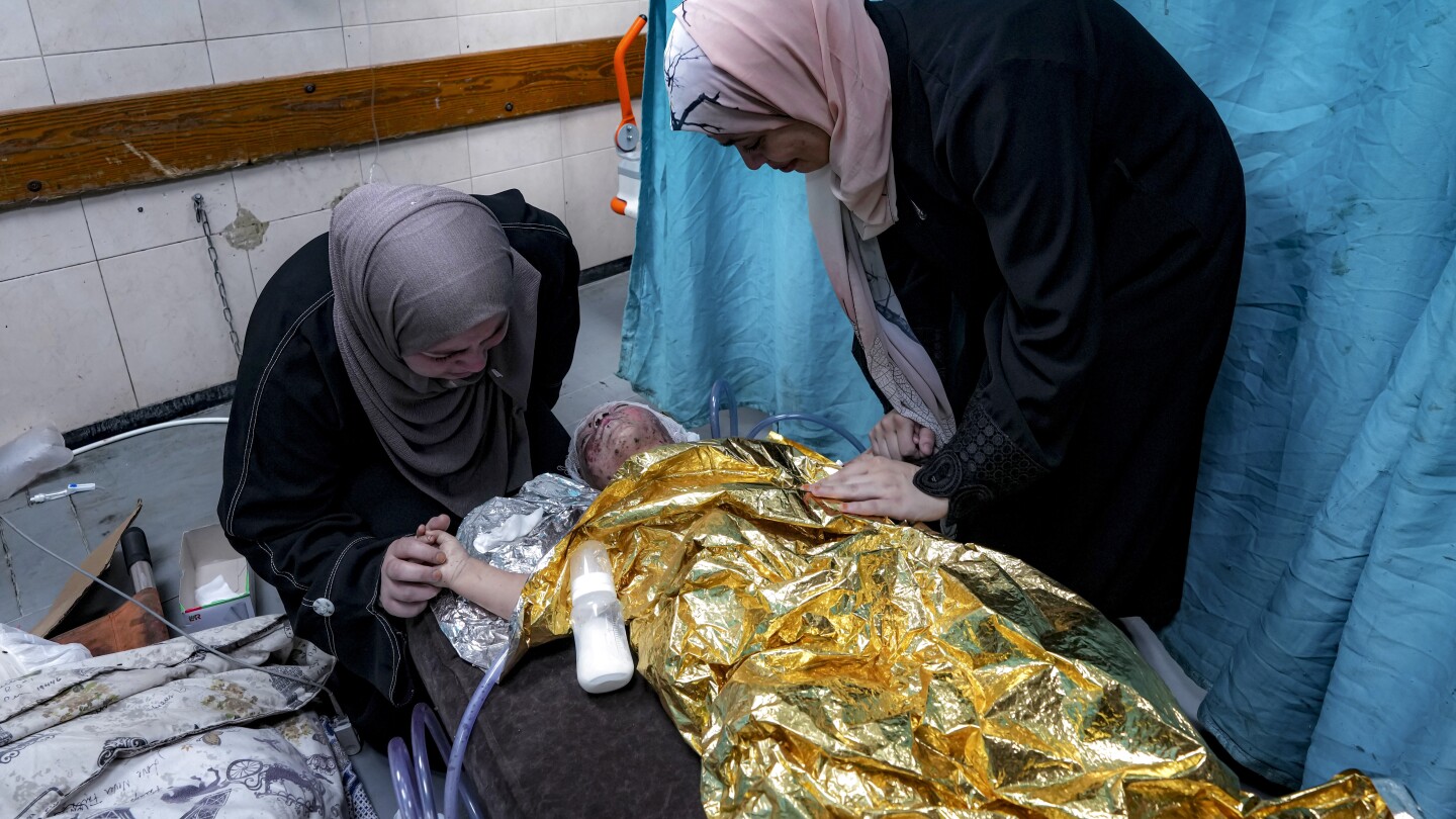 Wounded in a strike that killed her family, a 2-year-old joins Gaza’s ranks of thousands of orphans