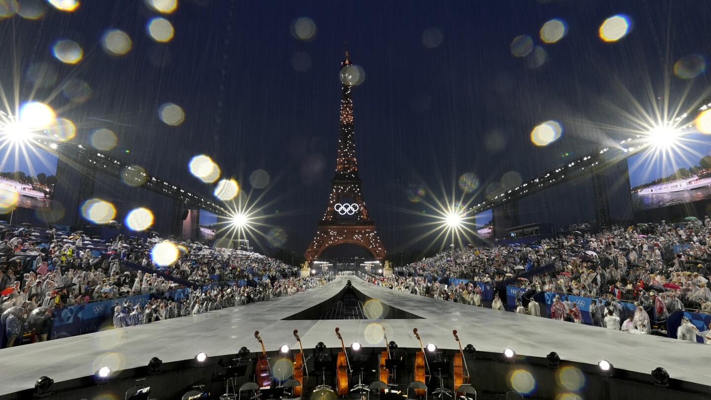 Paris glitters in the rain for ambitious Olympic opening ceremony