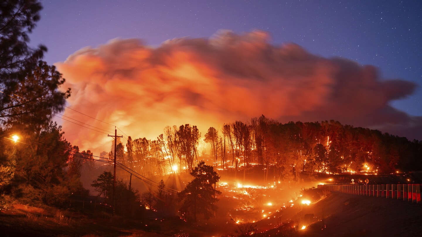 California’s largest wildfire explodes in size as fires rage across US West