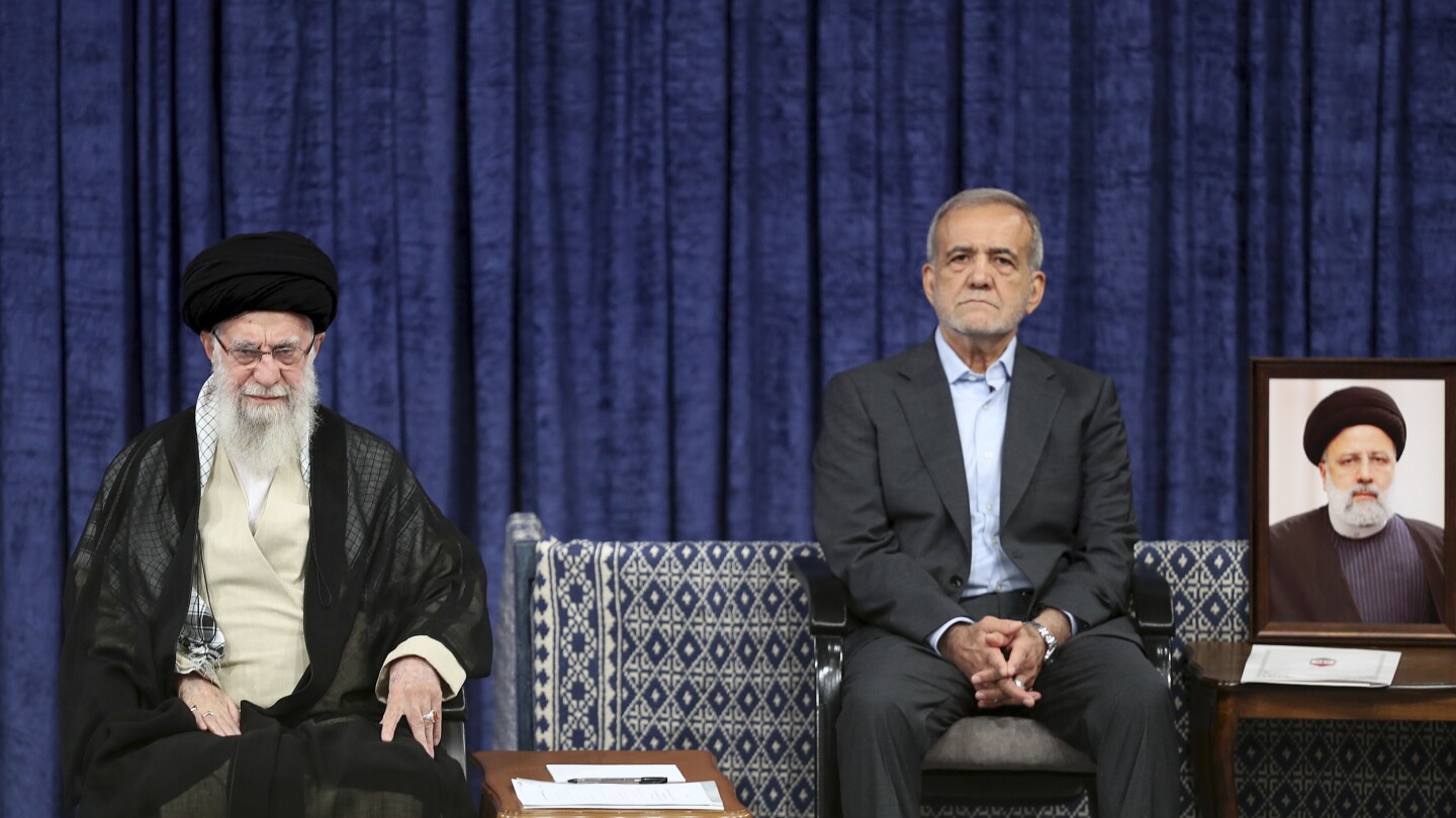 Reformist formally takes over as Iran’s president after supreme leader offers endorsement