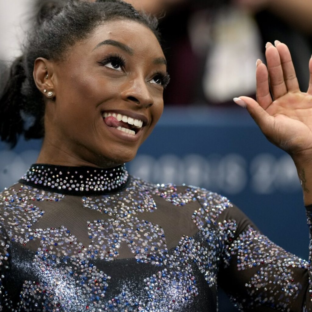 Biles and Team USA mix glamour and grit to surge to the lead at Olympic gymnastics qualifying