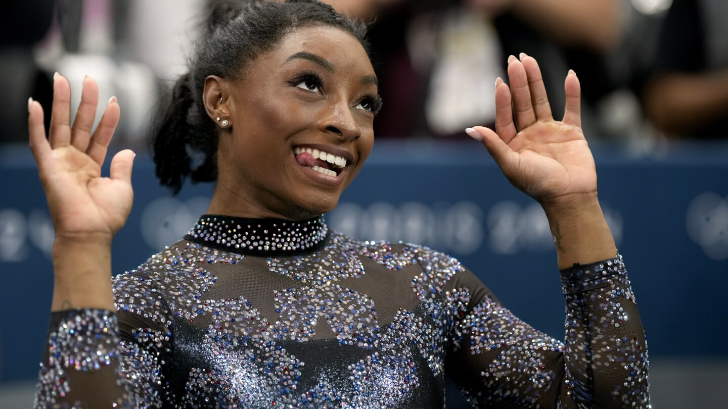 Biles and Team USA mix glamour and grit to surge to the lead at Olympic gymnastics qualifying