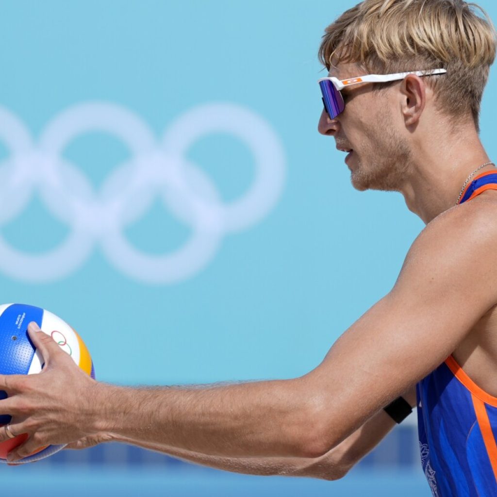 Dutch beach volleyball player who was convicted of rape is booed before losing first Olympic match