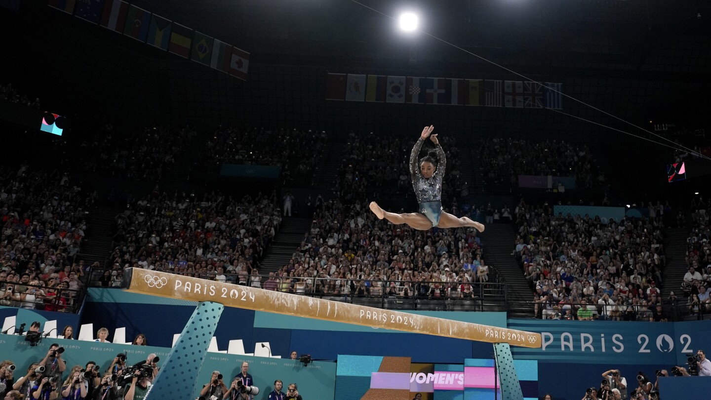 One Extraordinary Photo: Charlie Riedel captures Simone Biles in flight at the Paris Games