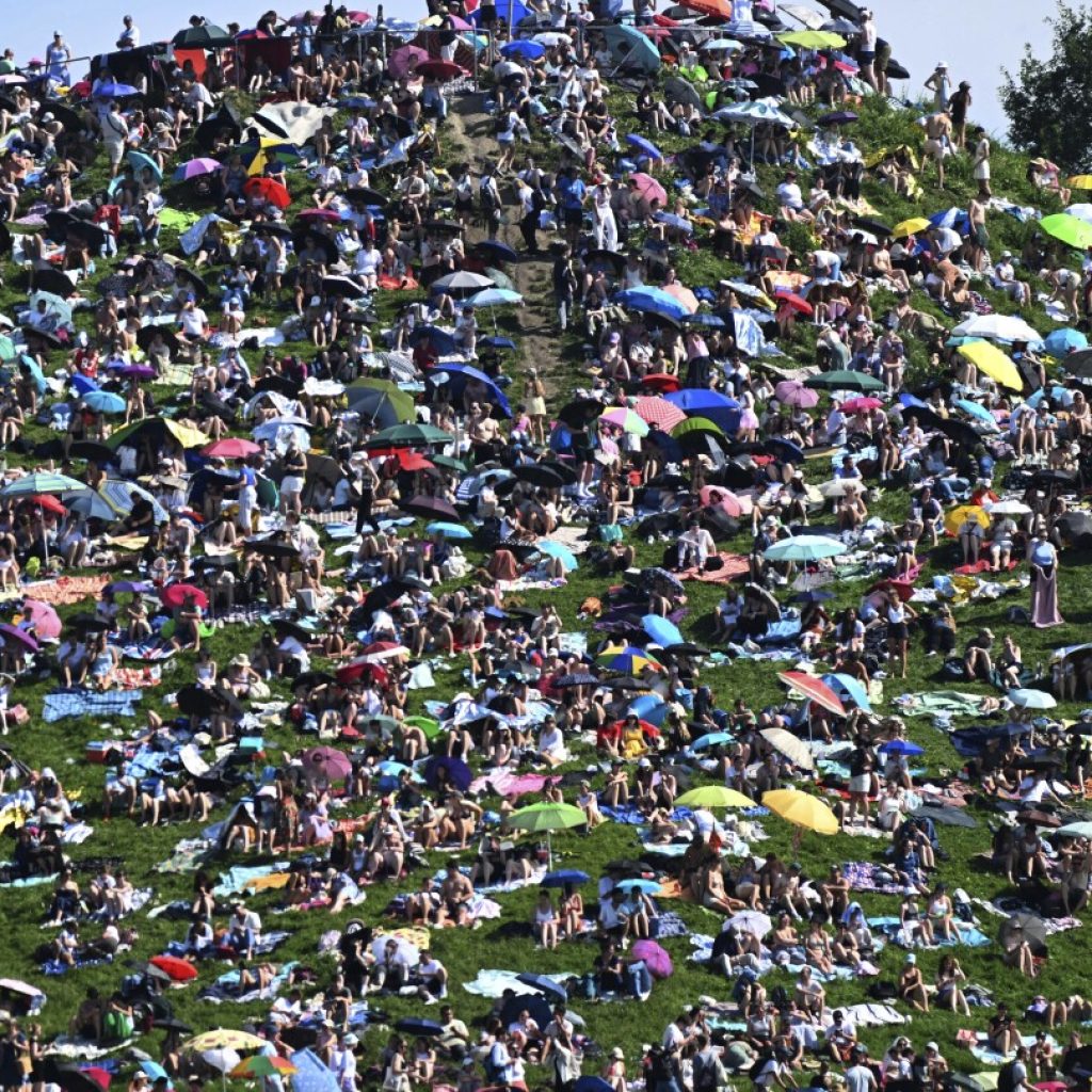 Fans swarm hill in Munich, claiming a high perch for watching Taylor Swift concert for free