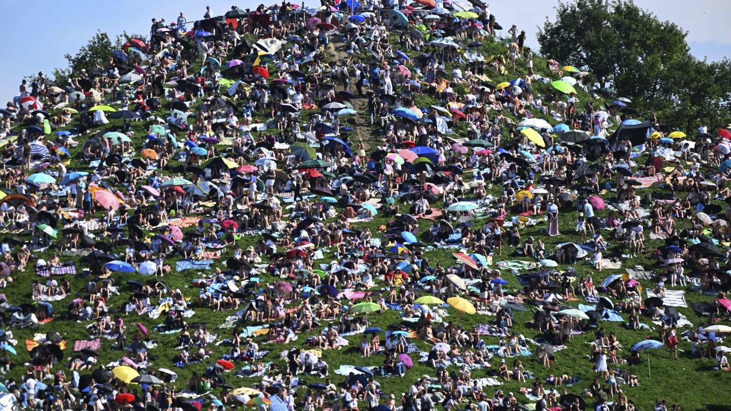 Fans swarm hill in Munich, claiming a high perch for watching Taylor Swift concert for free