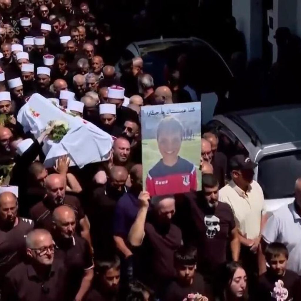 Community in Israeli-controlled Golan Heights holds funerals for young people killed in rocket attack from Lebanon | AP News