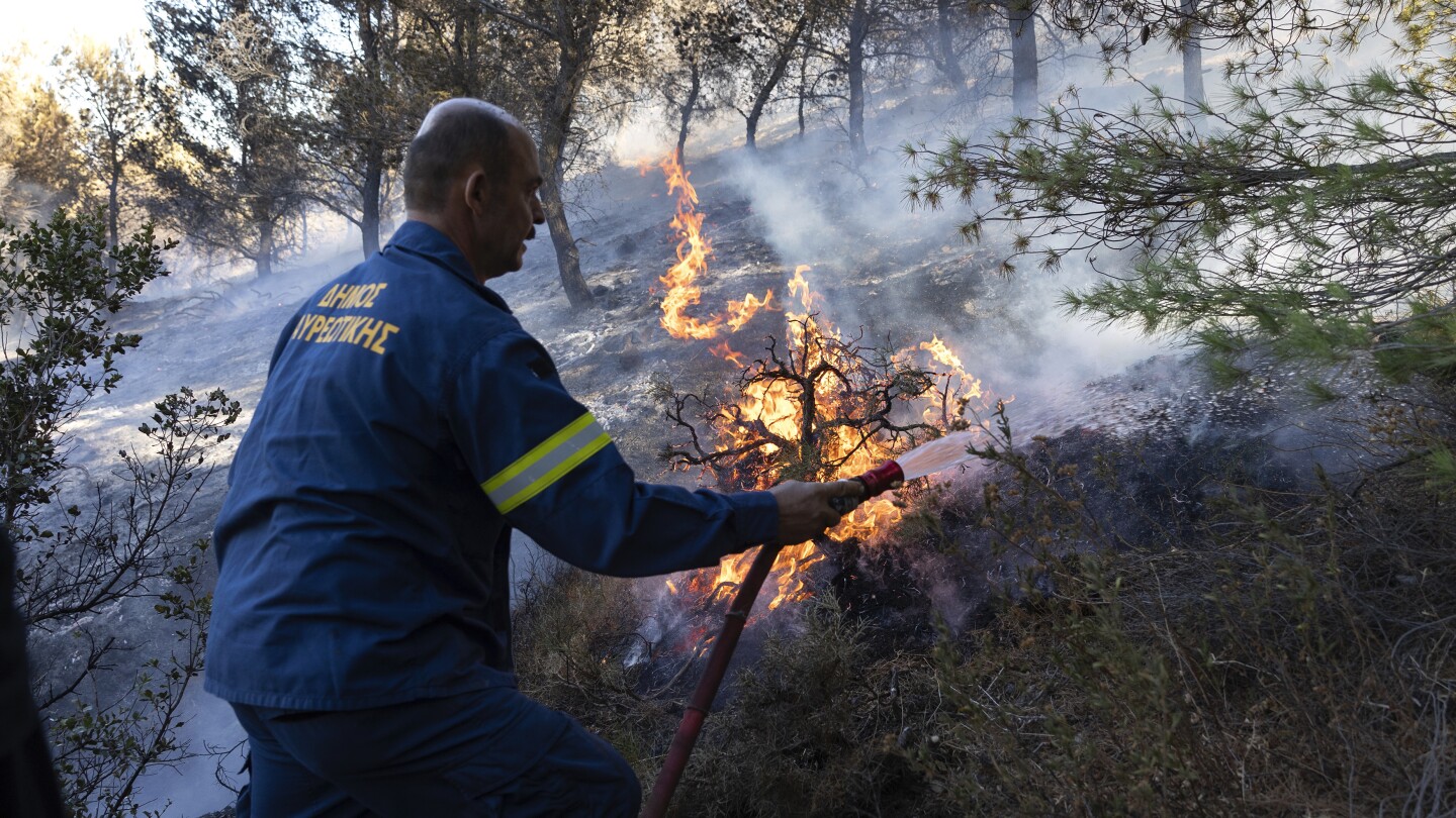 Multiple evacuations ordered in southern Greece as wildfires return to fire-struck island