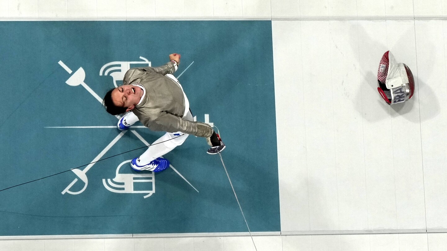 One Extraordinary Olympic Photo: Christophe Ena captures the joy of fencing gold at the Paris Games