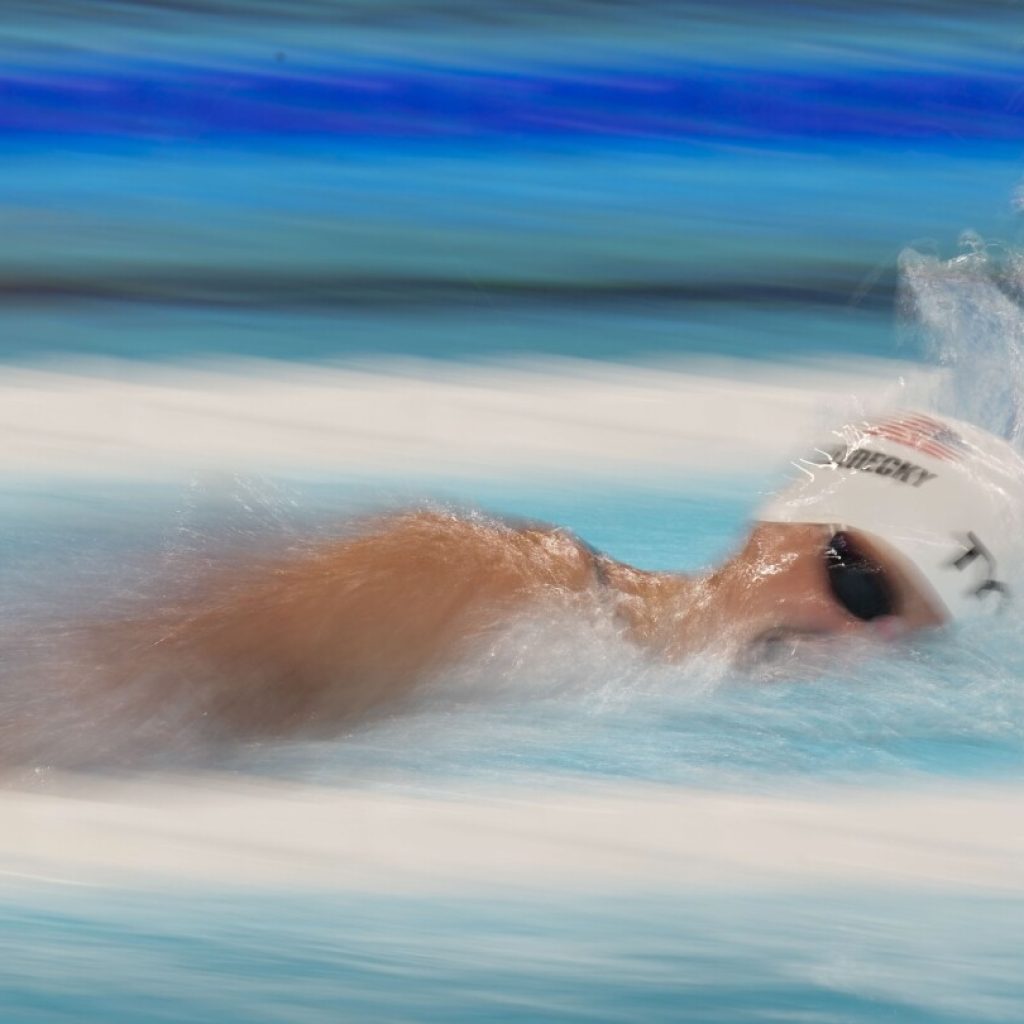 Olympic swimming: Ledecky is fastest in heats of 1500; Marchand advances in 2 more races