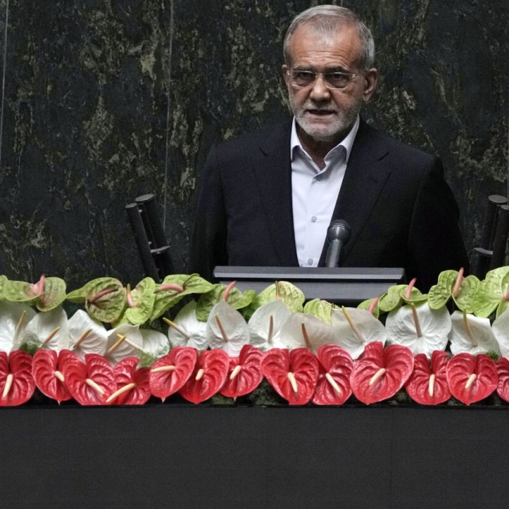 Iran’s new president is sworn in and pledges to keep trying to remove Western sanctions