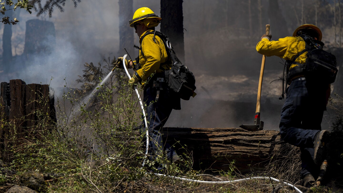 Firefighters make progress against massive blaze in California ahead of warming weather