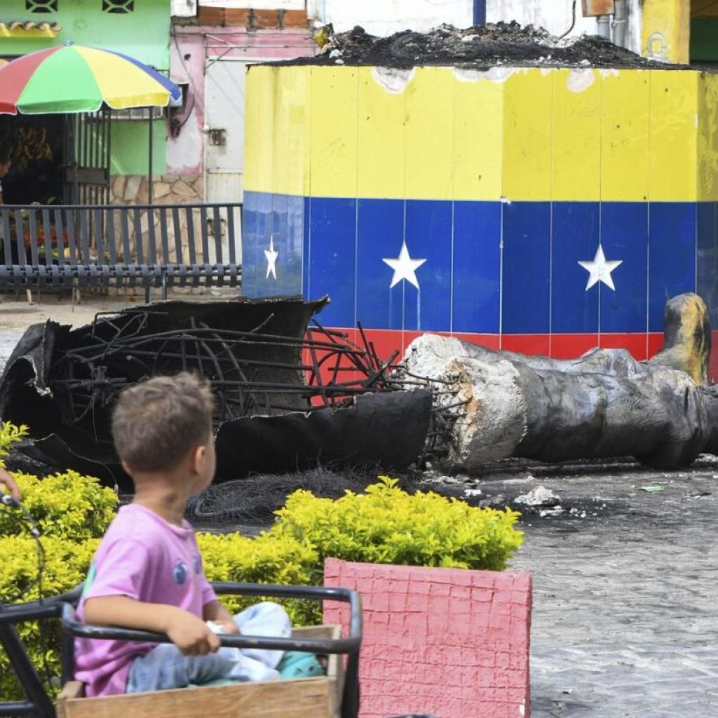 Protesters topple statues of Hugo Chavez in Venezuela as anger at election result grows | AP News