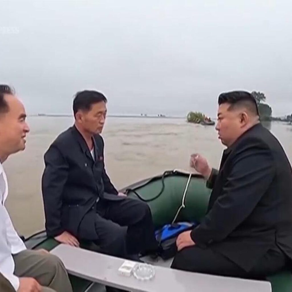 North Korea leader and senior officials board small boat to inspect impact of devastating floods | AP News