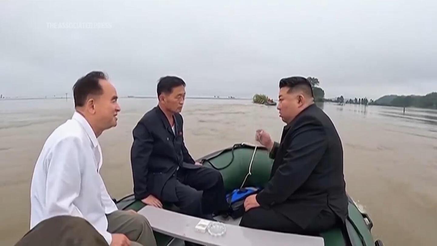 North Korea leader and senior officials board small boat to inspect impact of devastating floods | AP News