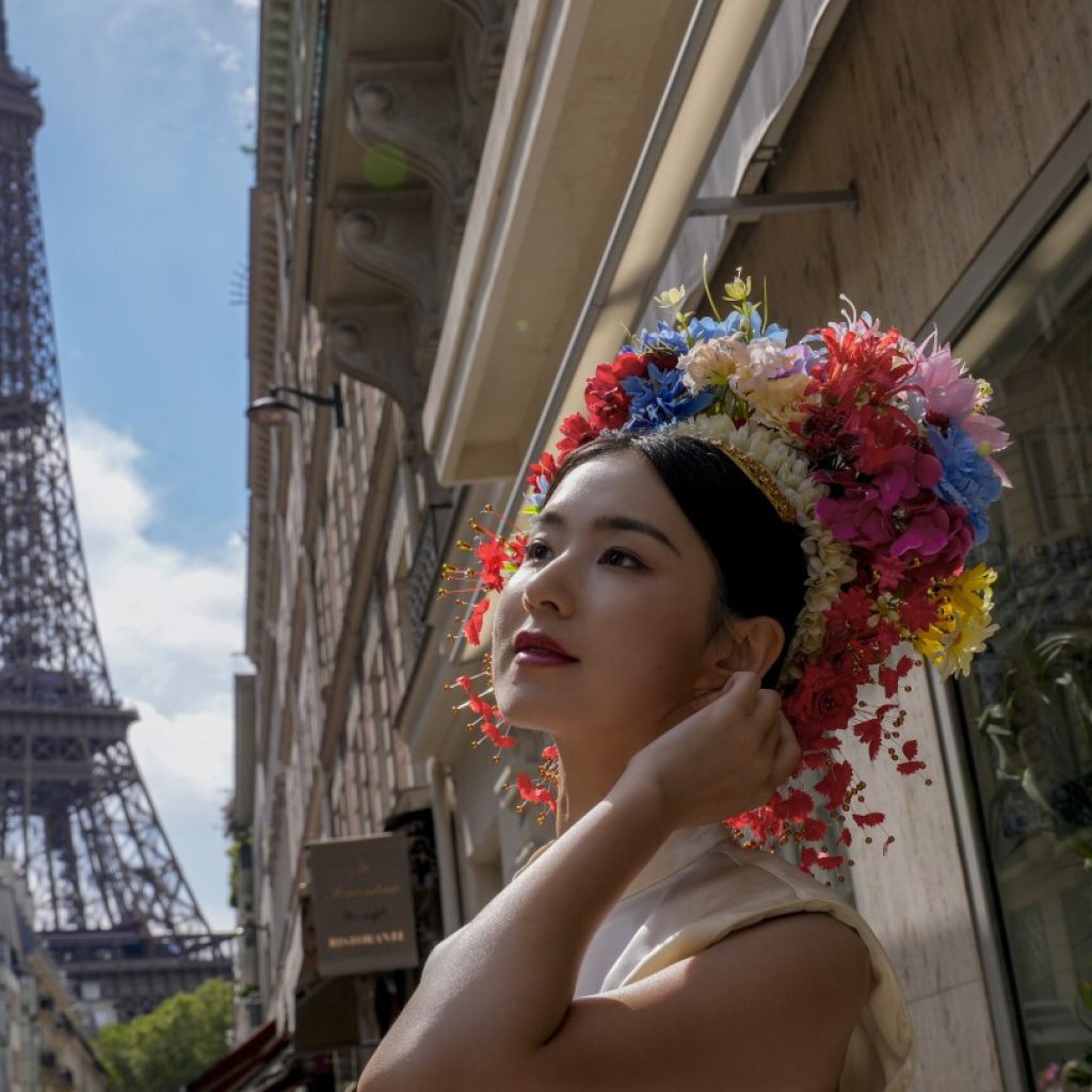 AP PHOTOS: With the Paris Games as their canvas, people are every aspect of the City of Lights