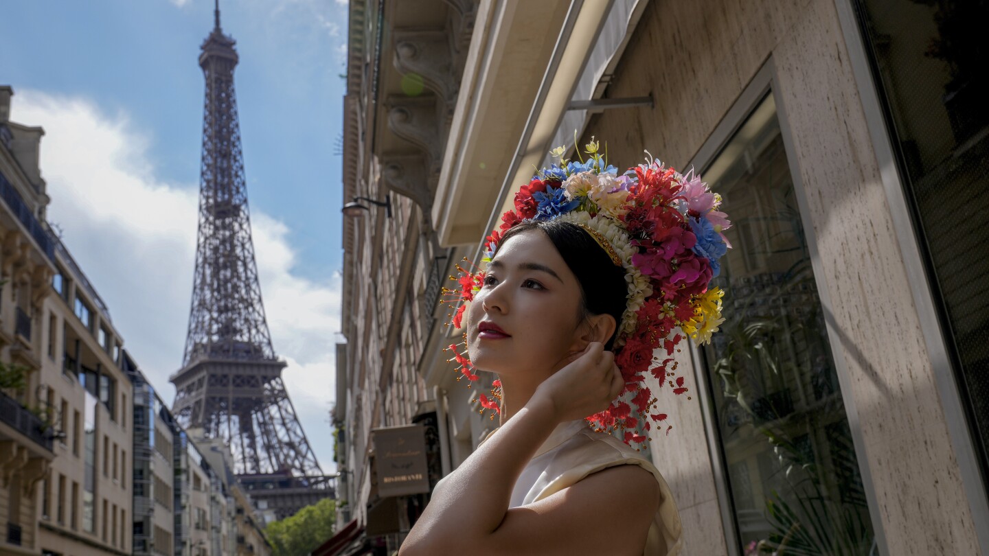 AP PHOTOS: With the Paris Games as their canvas, people are every aspect of the City of Lights