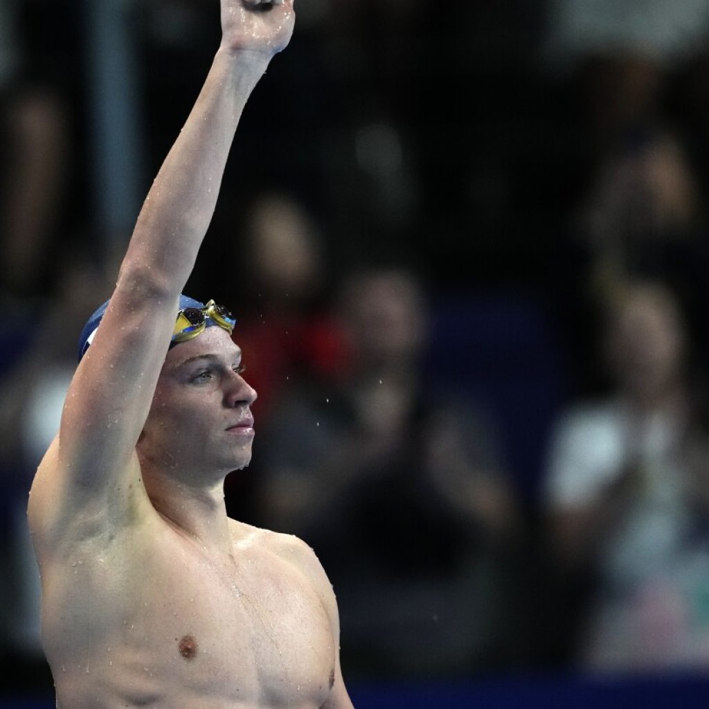 Léon Marchand rallies for a second gold medal, beating Milák in the 200 fly to begin a busy night